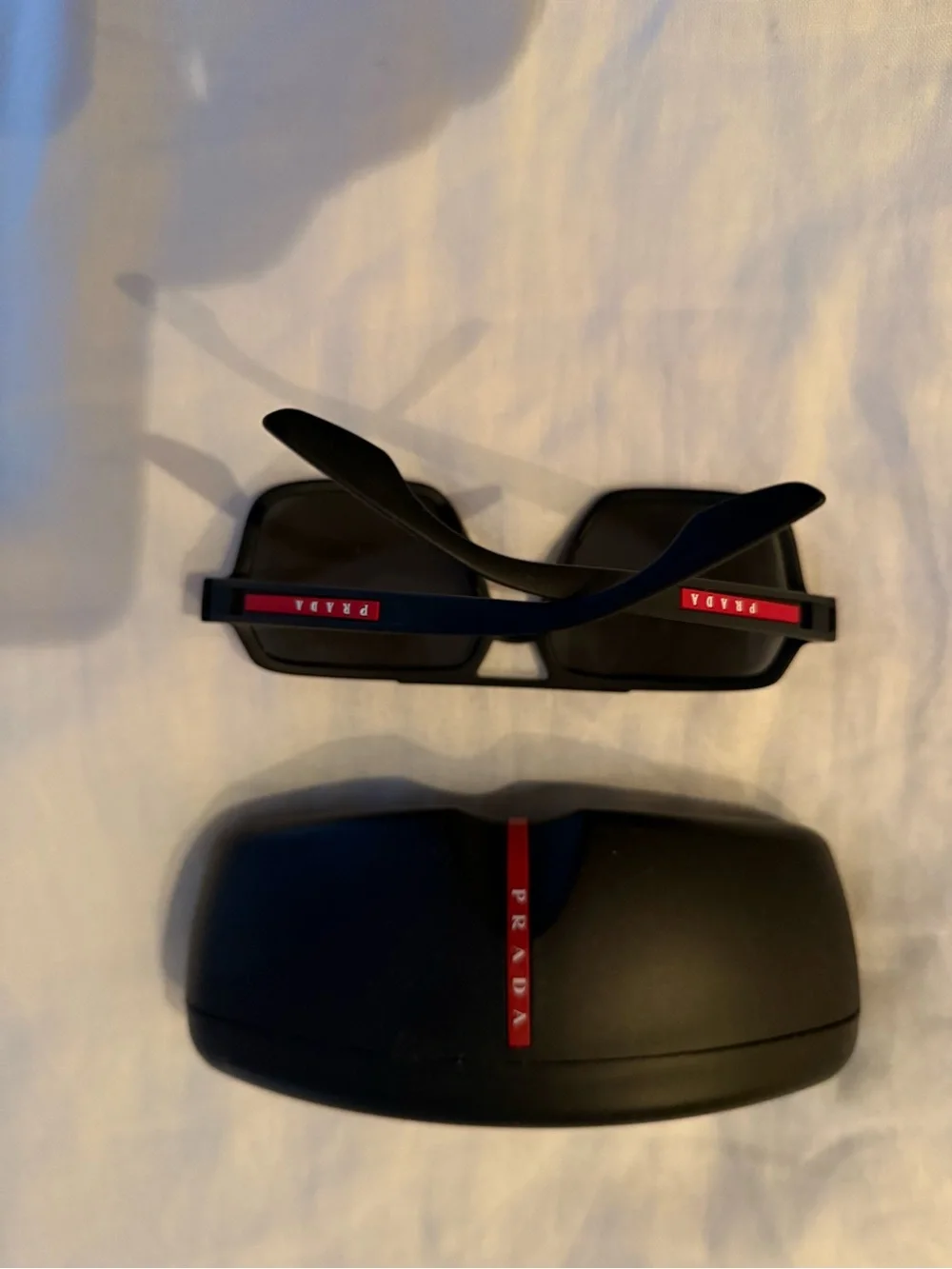 Prada linea rossa Black Frame Sunglasses with Red Gradient Lenses
